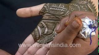 Mehndi is a cultural institution in India: Woman gets Henna tattoos