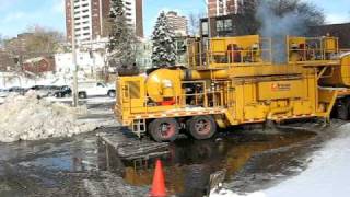 Snow Melter Clears Mountain of Snow