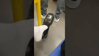 Dangling in front of people in train 1