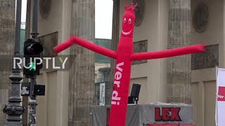 Germany: Bank employees rally in Berlin as union 'warning strikes' kick off