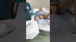 Foley catheter insertion on female