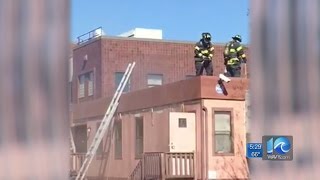 Firefighter falls through roof during working fire