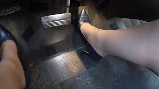 driving in dark blue heels from the left side