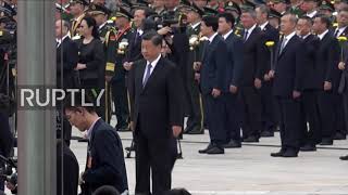 China: Xi pays respects at Tiananmen Square Martyr"s Day procession