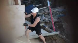 David Warner trades his baggy green for a workers helmet