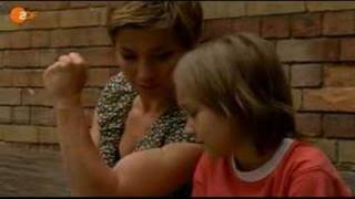 Claudia Schmutzler flexing her biceps