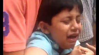 Boy Crying and Trying to Save Goat Fom Slaughter