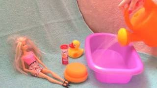Washing Barbie hair and body Barbie