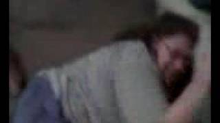 Small man wrestles large woman