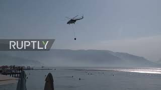 Turkey: Helicopters dump bay water on Marmaris fires as people watch from beaches