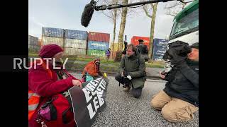 Germany: Environmental activists block port by glueing themselves to road *STILLS*