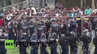 Hungary: Riot police use tear gas as refugees attempt to break out of detention camp