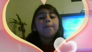 A young girl singing "THE CLIMB'
