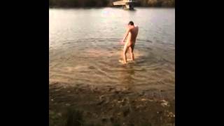 Naked boy in lake