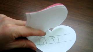 Valentine: pink heart-shaped book for spelling and writing practice.