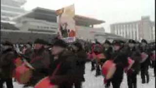 North Koreans stage mass rally