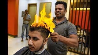 Brave customers let barber cut their hair with fire! :D