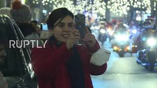 Santas roll into German capital to spread Christmas cheer