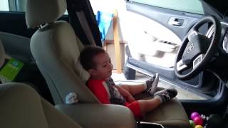 Beaux jamming out while daddy cleans the car!