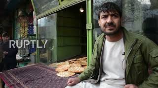 Afghanistan: Kabul residents queue for food amid winter food shortage