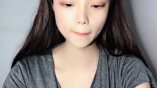 Chinese RAE amputee one arm girl applying cream with her stump