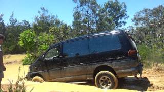 Mitsubishi Delica off road crossing water and mud