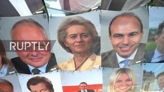 Germany: Pro-refugee activists form giant mosaic with politicians" portraits outside Bundestag