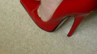Red Ellite High Heels worn by a man!!!!