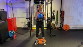 LEGS - ELEVATED HEELS HACK SQUAT WITH KETTLE BELL