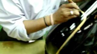 Magic Hands - Painting the fuel tank of a Royal Enfield Motorcycle