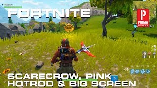 Fortnite - Search Between a Scarecrow, Pink Hotrod, and Big Screen