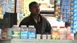A Paanwala making Paan at a roadside stall