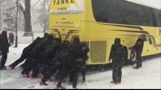 College Women's BBall Team Pushes Bus In Snow