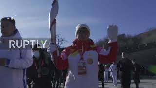 China: Actor Jackie Chan carries Olympic torch on the Great Wall