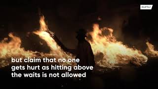 Locals hit each other with burning brooms at fiery festival in Spain