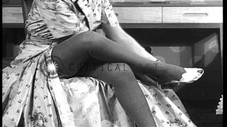A woman wears a dress and stockings HD Stock Footage