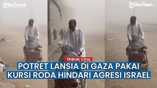Potret Wanita Lansia dengan Kursi Roda Hindari Serangan Bom Israel