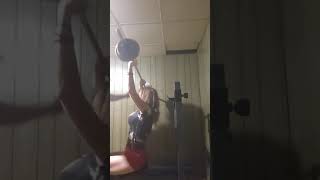 Mommy and daddy lifting weights teamwork
