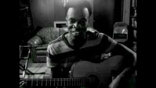 William McMillan playing guitar and Singing "I have decided to follow Jesus/trust and Obey"