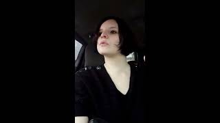 Woman smoking cigarette during a car ride