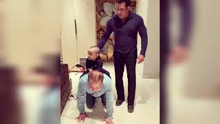 Salman Khan and Salman Khan's father playing with Arpita Khan's son