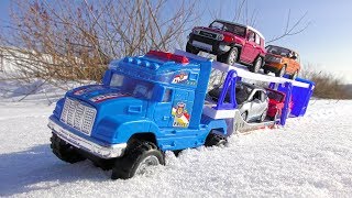 Cars for kids riding through the snow then transported by truck