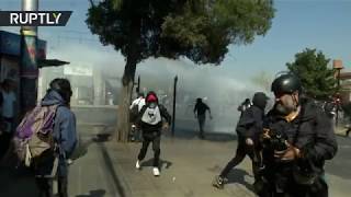 Police use tear gas and water cannons against protesters during 45th Coup anniversary in Chile