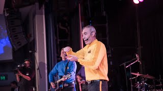 Original yellow Wiggle hospitalised after collapse during charity concert