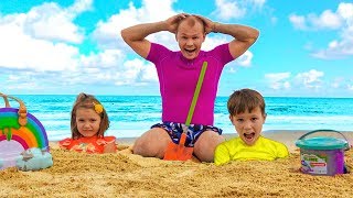 Max and daddy with Katy playing on the Beach