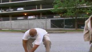 Kenny Smith tries to emulate Kobe Bryant by jump over  car with "Nike Hyperdunks"
