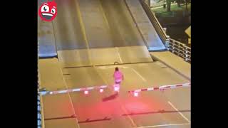 Cyclist Falls Into Opening Draw Bridge