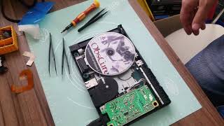 PlayStation 2 не читает диски и трещит моторчик