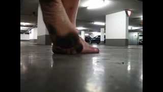 Barefoot in a public car park