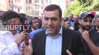Lebanon: Amal Movement and Hezbollah supporters rally outside Beirut court in protest